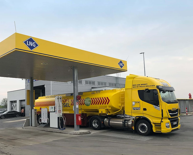 Yellow truck behind LNG gas station in Graz
