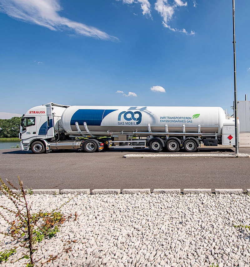 LNG truck with RAG branding in front of an LNG filling station