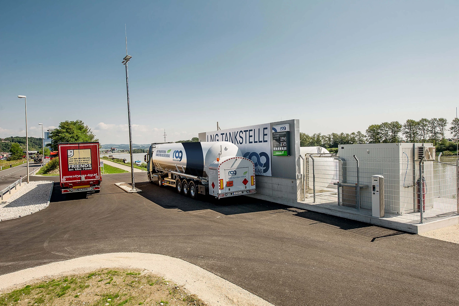LNG truck with RAG branding seen from behind in front of RAG LNG filling station